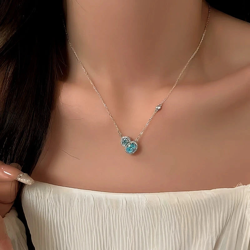 Close-up of the pendant and clasp on the gold gourd necklace