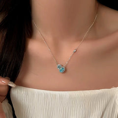 Close-up of the pendant and clasp on the gold gourd necklace