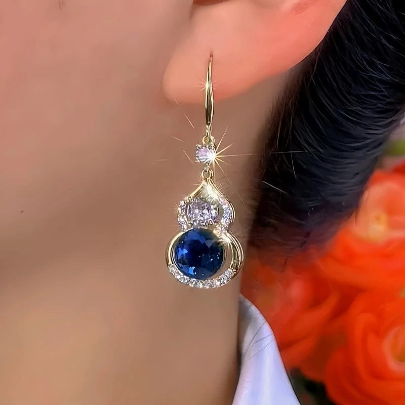 Angled view of the 14K Gold-Plated Elegant Zircon Gourd Ear Hook Earrings