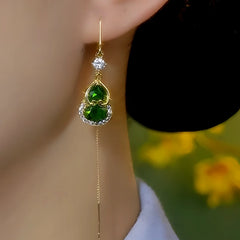 Model showcasing the dangle and style of the 14K Gold-Plated Elegant Zircon Green Crystal Gourd Threader Earrings