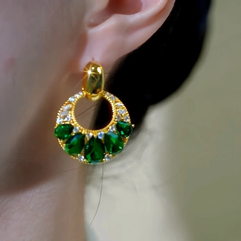 Close-up detail of the sparkling zircons and plating on the green tassel earrings