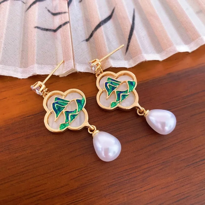 Angled view of the 14K Gold-Plated Elegant Zircon Green Mountain Pearl Tassel Earrings