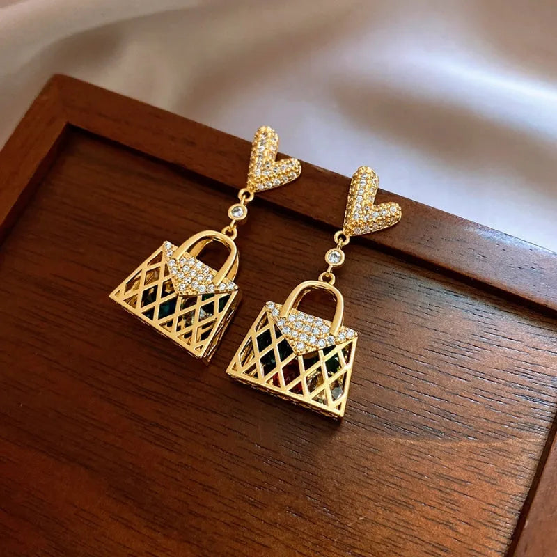 Close-up detail of the sparkling zircons and plating on the silver tassel earrings