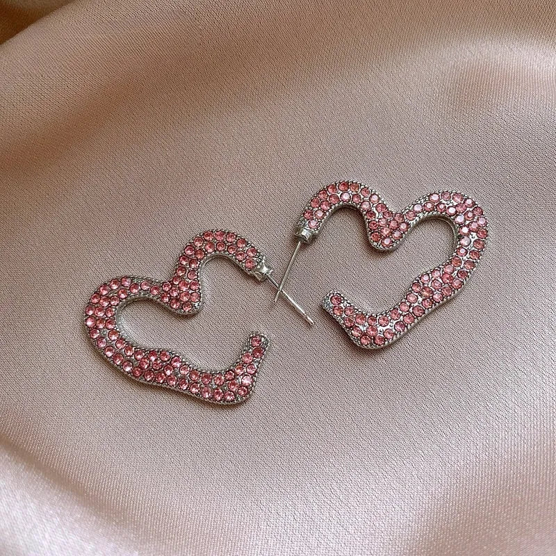 Angled view of the 14K Gold-Plated Elegant Zircon Heart Earrings