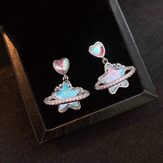 Model showcasing the dangle and style of the 14K Gold-Plated Elegant Zircon Heart Earrings