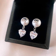 Angled view of the 14K Gold-Plated Elegant Zircon Heart Pearl Earrings