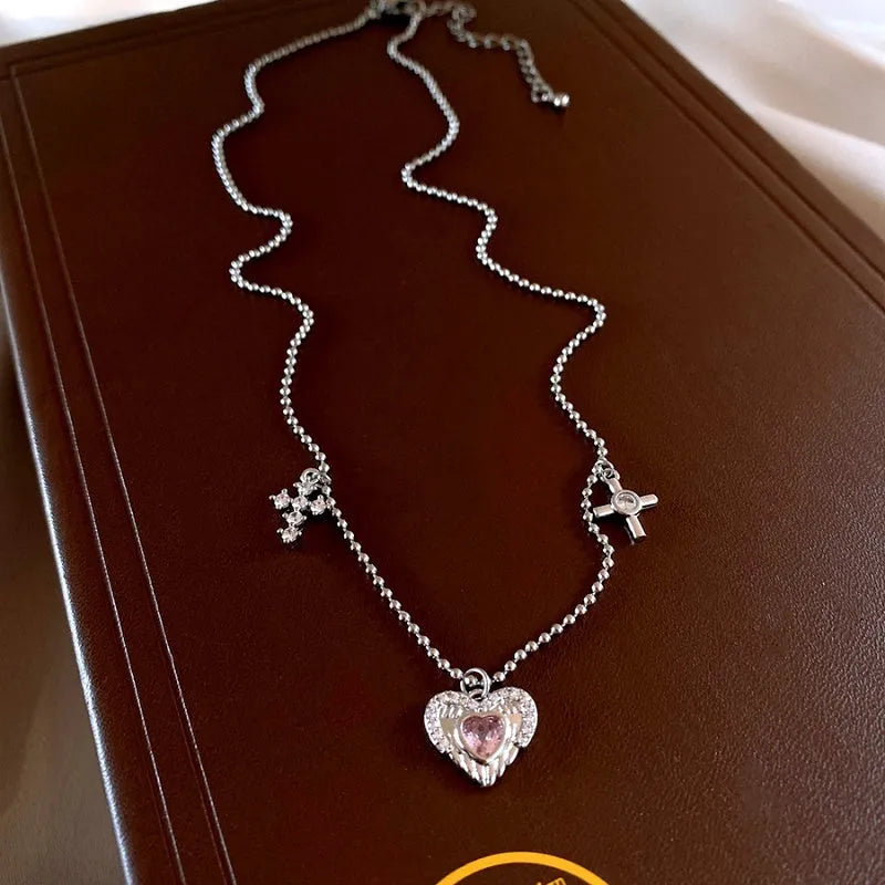 Close-up of the pendant and clasp on the silver heart necklace