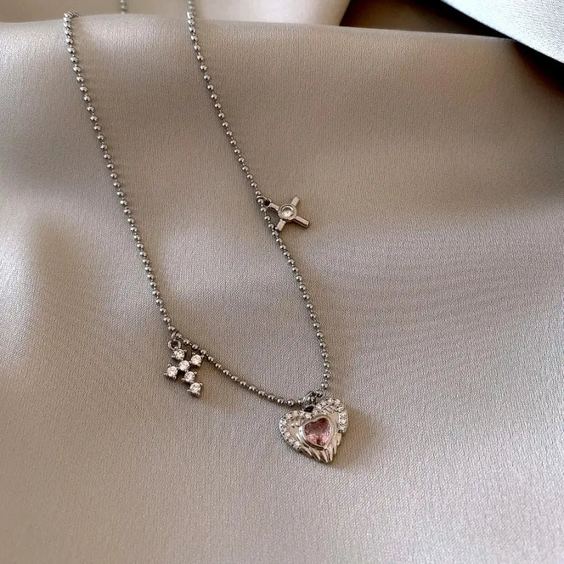 14K Gold-Plated Elegant Zircon Heart Pendant Heart Earrings worn to showcase its length and pendant detail