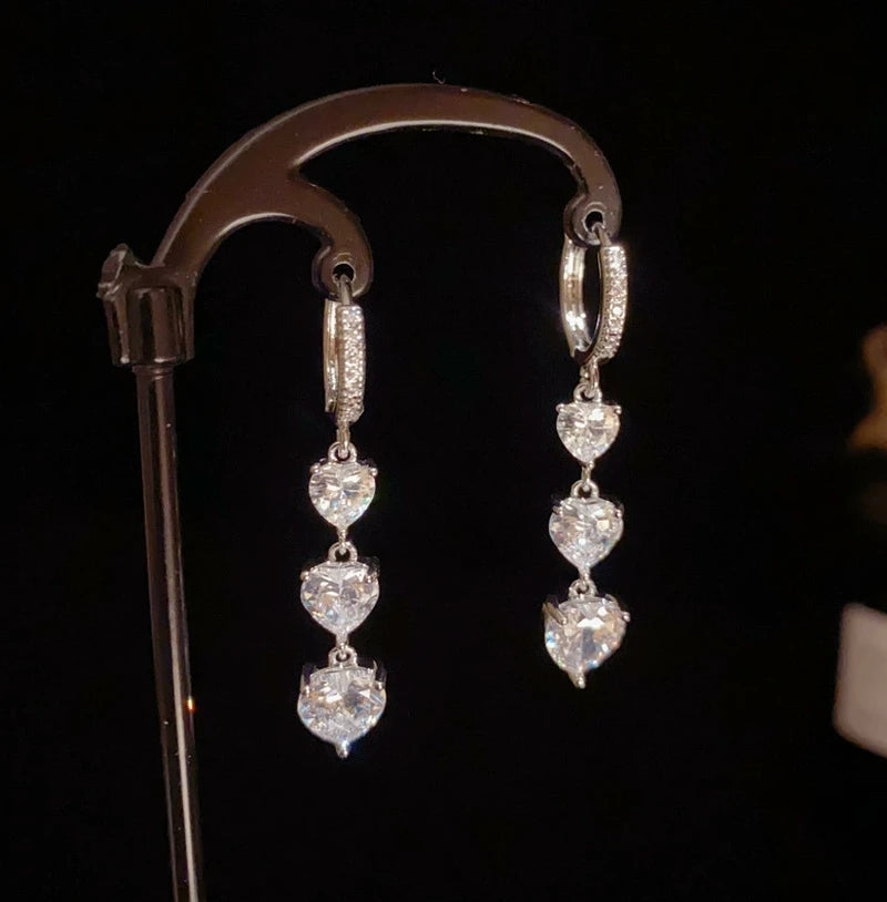 Angled view of the 14K Gold-Plated Elegant Zircon Heart Tassel Earrings