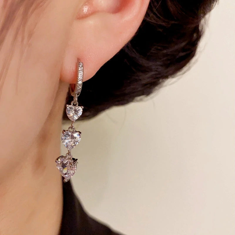 Close-up detail of the sparkling zircons and plating on the silver tassel earrings