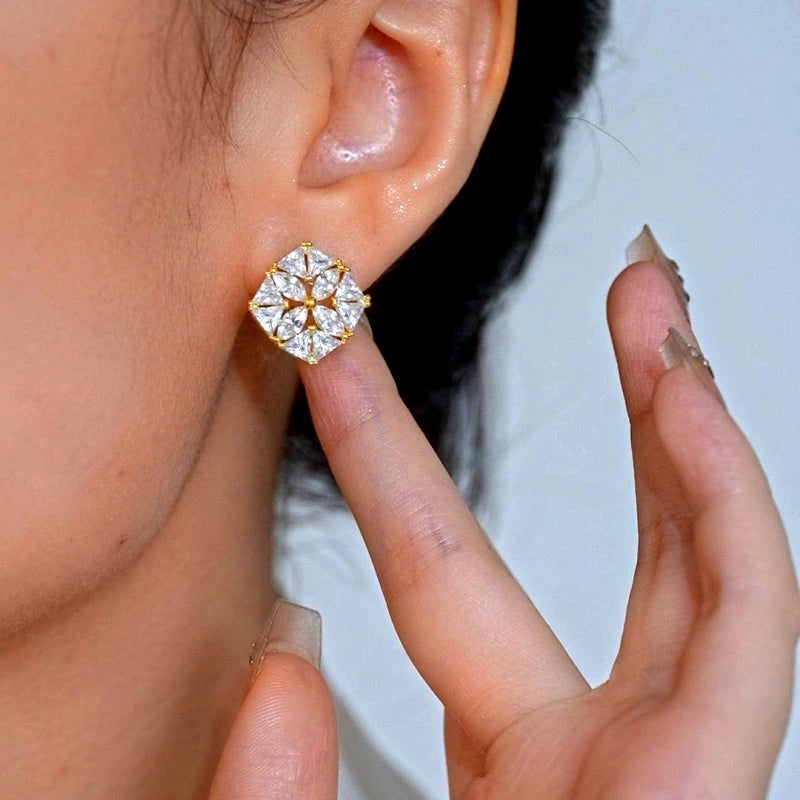 Model showcasing the dangle and style of the 14K Gold-Plated Elegant Zircon Hollow Flower Stud Earrings