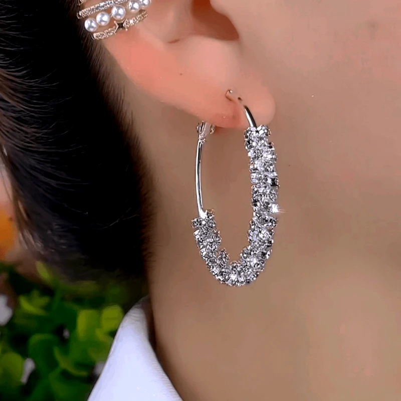 Model showcasing the dangle and style of the 14K Gold-Plated Elegant Zircon Hoop Earrings