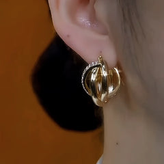 Model showcasing the dangle and style of the 14K Gold-Plated Elegant Zircon Irregular Earrings