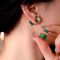 Close-up detail of the sparkling zircons and plating on the gold jacket earrings