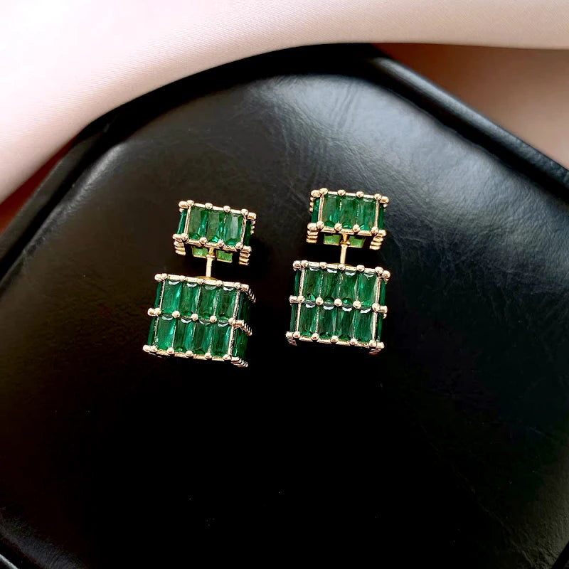 Styling the gold jacket earrings for a chic and modern look