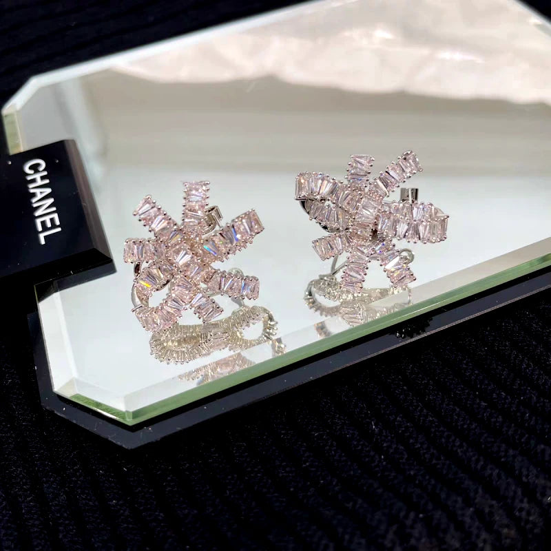 Angled view of the 14K Gold-Plated Elegant Zircon Knotted Flower Earrings