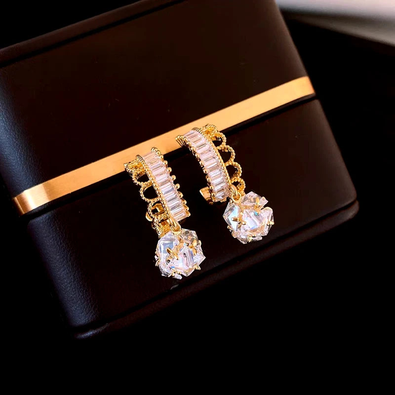 Angled view of the 14K Gold-Plated Elegant Zircon Lace Ball Earrings
