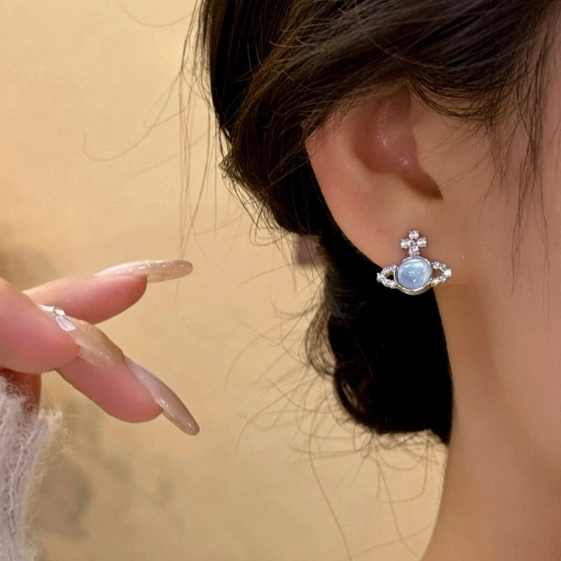 Model showcasing the dangle and style of the 14K Gold-Plated Elegant Zircon Lantern Earrings