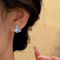 Close-up detail of the sparkling zircons and plating on the silver stud earrings