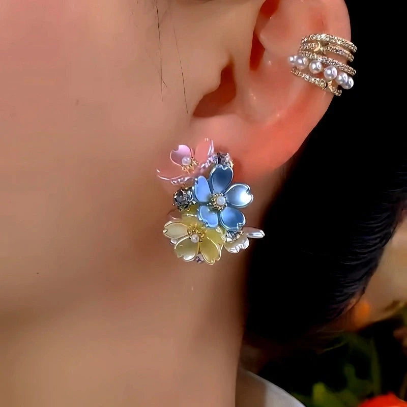 Model showcasing the dangle and style of the 14K Gold-Plated Elegant Zircon Leaf Earrings