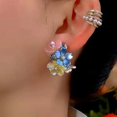 Model showcasing the dangle and style of the 14K Gold-Plated Elegant Zircon Leaf Earrings