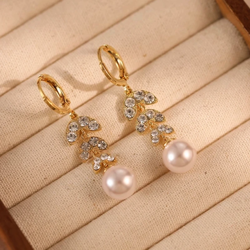 Angled view of the 14K Gold-Plated Elegant Zircon Leaf Pearl Tassel Earrings