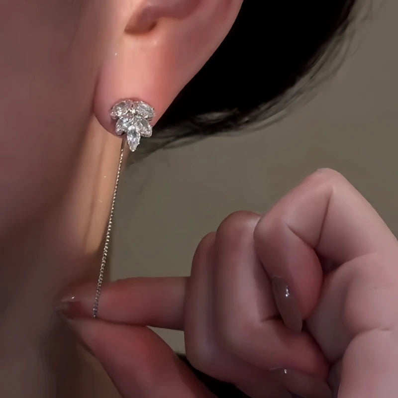 Close-up detail of the sparkling zircons and plating on the silver threader earrings