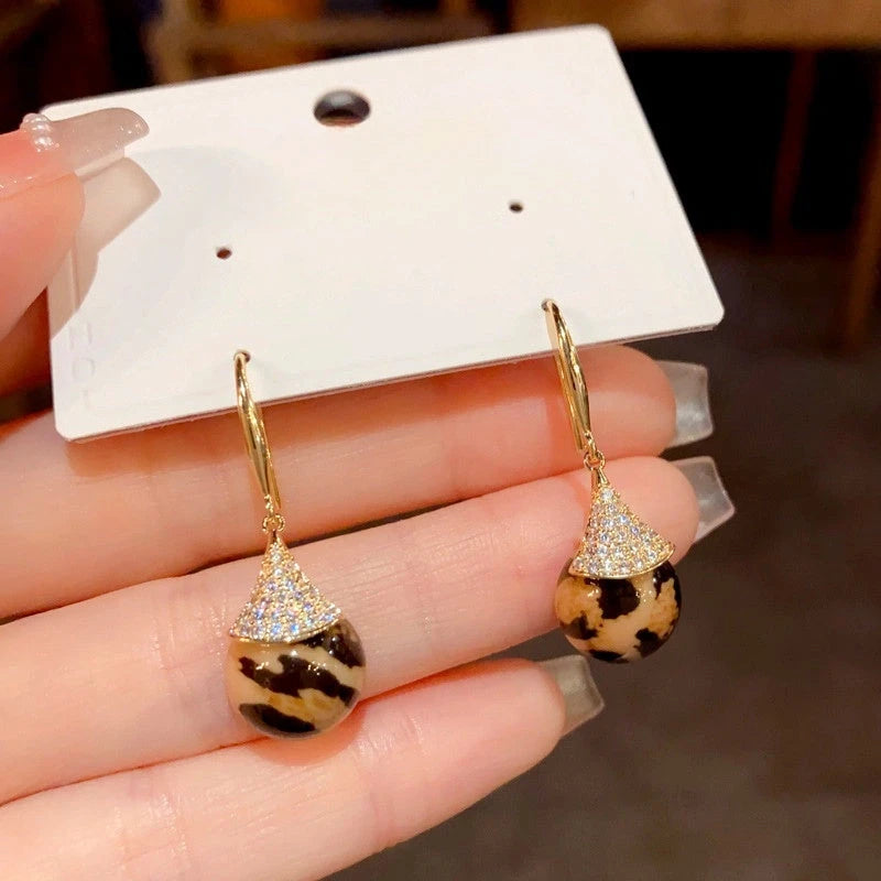 Angled view of the 14K Gold-Plated Elegant Zircon Leopard Ear Hooks