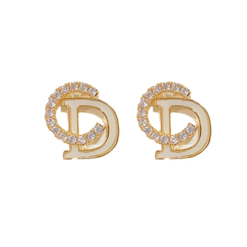 Angled view of the 14K Gold-Plated Elegant Zircon Letter CD Stud Earrings