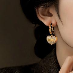 Angled view of the 14K Gold-Plated Elegant Zircon Letter Heart Earrings