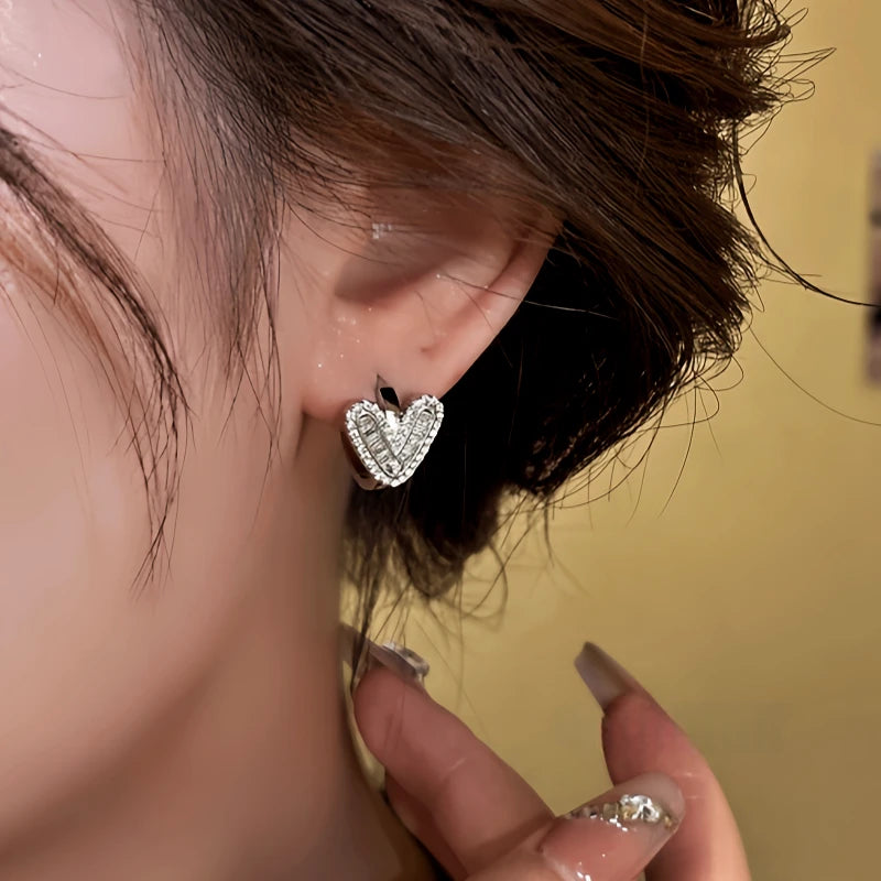 Close-up detail of the sparkling zircons and plating on the gold hoop earrings