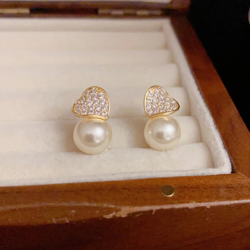 Angled view of the 14K Gold-Plated Elegant Zircon Love Pearl Earrings