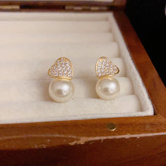 Angled view of the 14K Gold-Plated Elegant Zircon Love Pearl Earrings