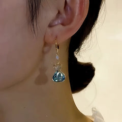 Perfect gold drop earrings for adding glamour to any outfit