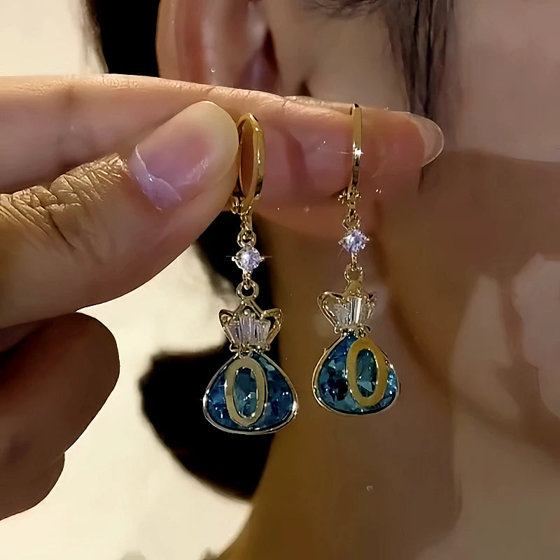 Angled view of the 14K Gold-Plated Elegant Zircon Lucky Bag Earrings