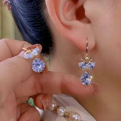 Close-up detail of the sparkling zircons and plating on the gold threader earrings