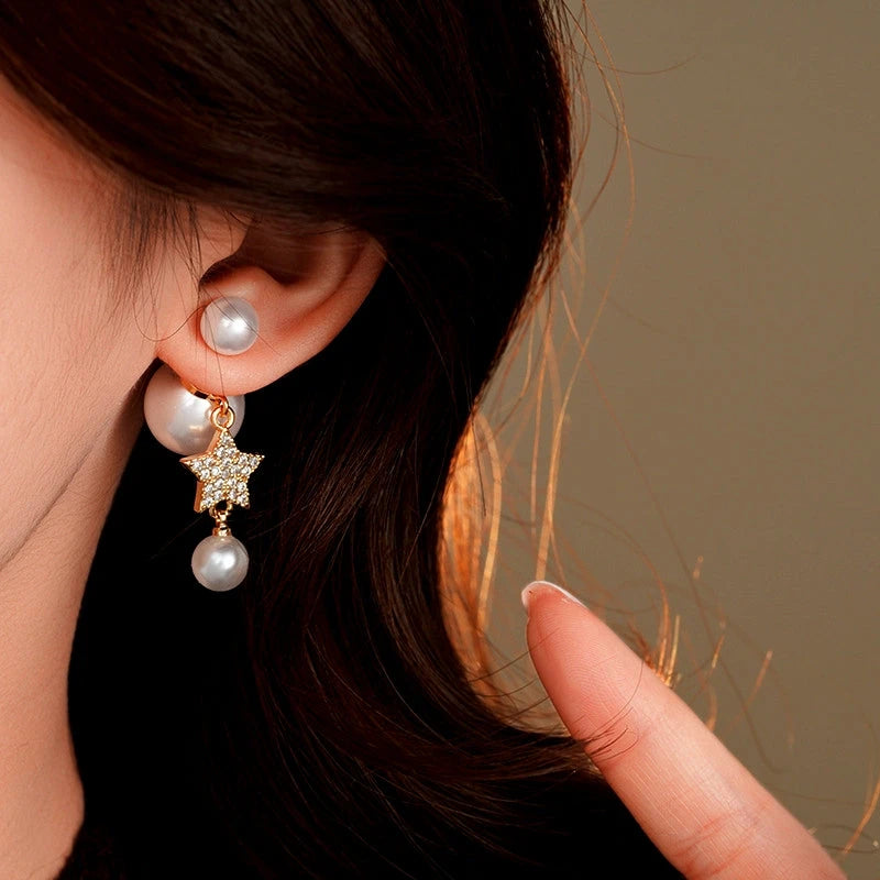 Close-up detail of the sparkling zircons and plating on the gold pearl earrings