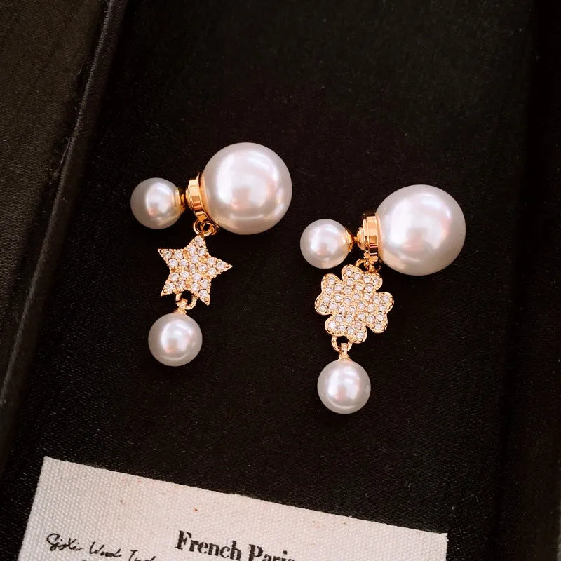 Angled view of the 14K Gold-Plated Elegant Zircon Maple Leaf Star Pearl Earrings