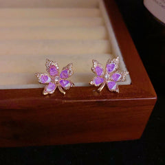 Close-up detail of the sparkling zircons and plating on the gold leaf earrings