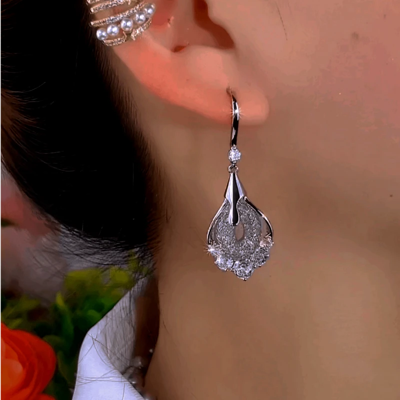 Close-up detail of the sparkling zircons and plating on the gold threader earrings