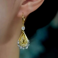 Model showcasing the dangle and style of the 14K Gold-Plated Elegant Zircon Mesh Water Drop Earrings