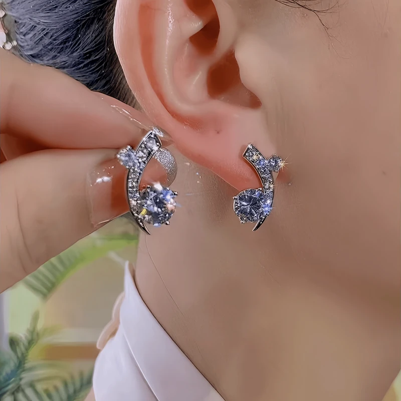 Angled view of the 14K Gold-Plated Elegant Zircon Moon Star Stud Earrings