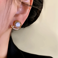 Angled view of the 14K Gold-Plated Elegant Zircon Moon Stud Earrings