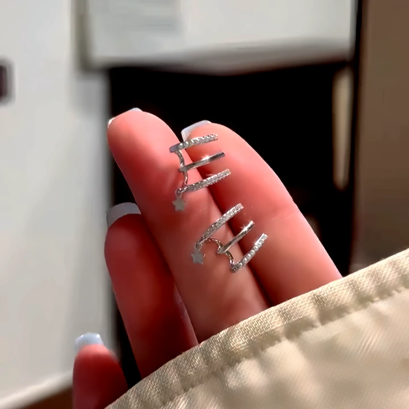 Angled view of the 14K Gold-Plated Elegant Zircon Multi-Layer Star Stud Earrings