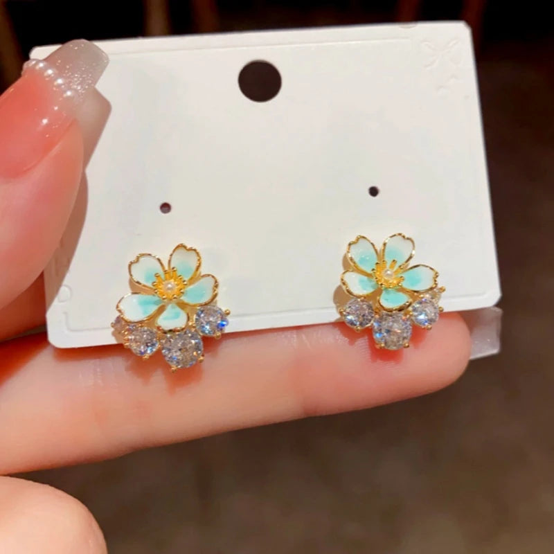 Angled view of the 14K Gold-Plated Elegant Zircon Oil Drop Flower Stud Earrings