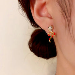 Model showcasing the dangle and style of the 14K Gold-Plated Elegant Zircon Oil Drop Snake Earrings
