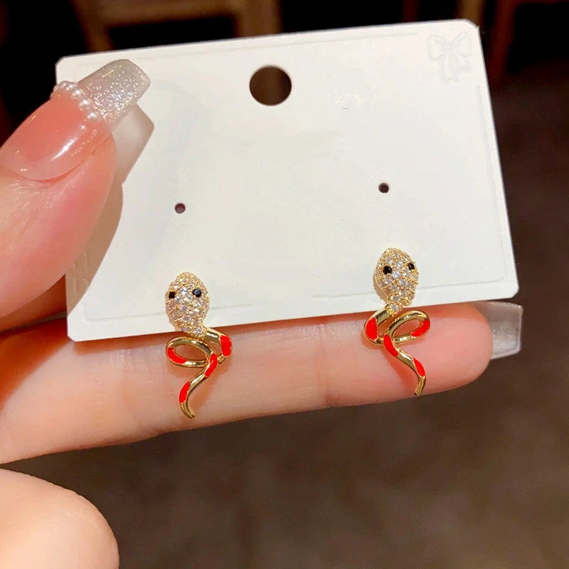 Angled view of the 14K Gold-Plated Elegant Zircon Oil Drop Snake Earrings