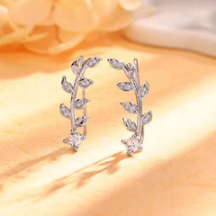 Close-up detail of the sparkling zircons and plating on the silver crawler earrings