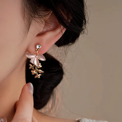 Angled view of the 14K Gold-Plated Elegant Zircon Painted Flower Tassel Earrings