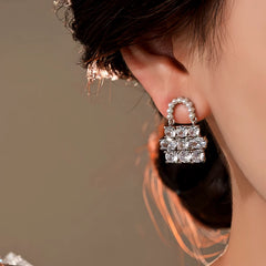 Close-up detail of the sparkling zircons and plating on the silver pearl earrings